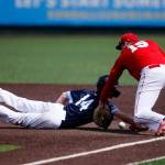 Meadowdales Broderick Bluhm gets his hand back to the bag on a throw to first against Stanwood Saturday, May 14, 2022, during a 3A district matchup at Funko Field in Everett, Washington. (Ryan Berry / The Herald)