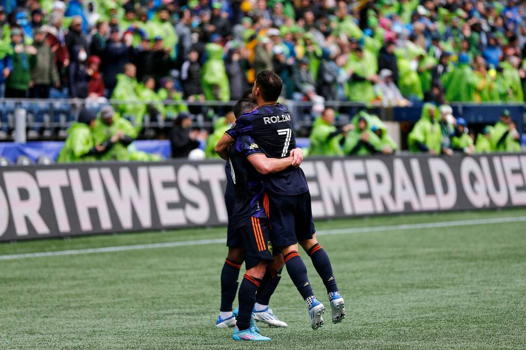 Seattle Sounders Cristian Roldán celebrates with teammates after scoring what would be the game-winning goal against Minnesota United Sunday at Lumen Field in Seattle. (Ryan Berry / The Herald)
