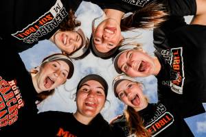 Monroe’s Jessi Mahler, top left clockwise, River Mahler, Emma Nagy, Scarlett Nagy, Annie Oylear and Hadley Oylear are members of the Bearcats starting lineup going into the playoffs. Photographed in Monroe, Washington on May 16, 2022. (Kevin Clark / The Herald)