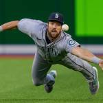 Seattle Mariners right fielder Steven Souza Jr. dives to try to catch a ball hit by Toronto Blue Jays' George Springer for a three-run triple during the second inning of a baseball game Tuesday, May 17, 2022, in Toronto. (Frank Gunn/The Canadian Press via AP)