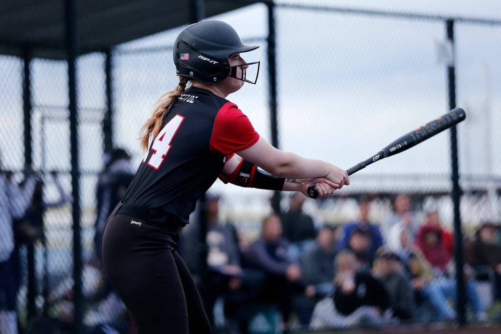 Snohomishs Skyla Bristol watches the ball fly after getting a hit against Everett during Tuesdays Class 3A District 1 matchup at the Phil Johnson Ballfields in Everett. (Ryan Berry / The Herald)