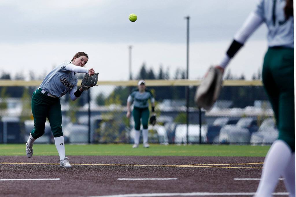 Jackson sophomore shortstop Rachel Sysum throws out a runner at first base. (Ryan Berry / The Herald)