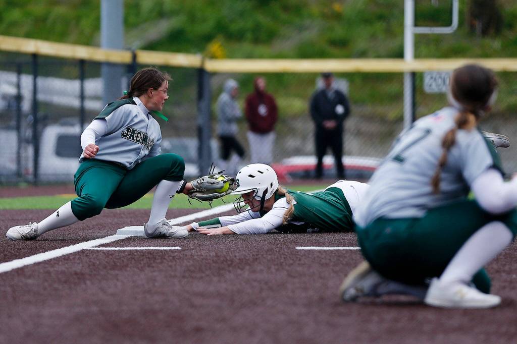 Skylines Ryan Grace slides in safely to third, setting herself up to score the game-winning run against Jackson during Wednesdays Class 4A matchup at the Phil Johnson Ballfields in Everett. (Ryan Berry / The Herald)