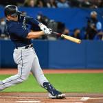 The Mariners Ty France hits a single during the first inning of a game against the Blue Jays on Wednesday in Toronto. (Jon Blacker/The Canadian Press via AP)