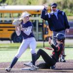 Arlingtons Avery Zodrow tags out Monroes Hadley Oylear at Phil Johnson Ball Field in Everett, Washington on May 19, 2022.(Kevin Clark / The Herald)