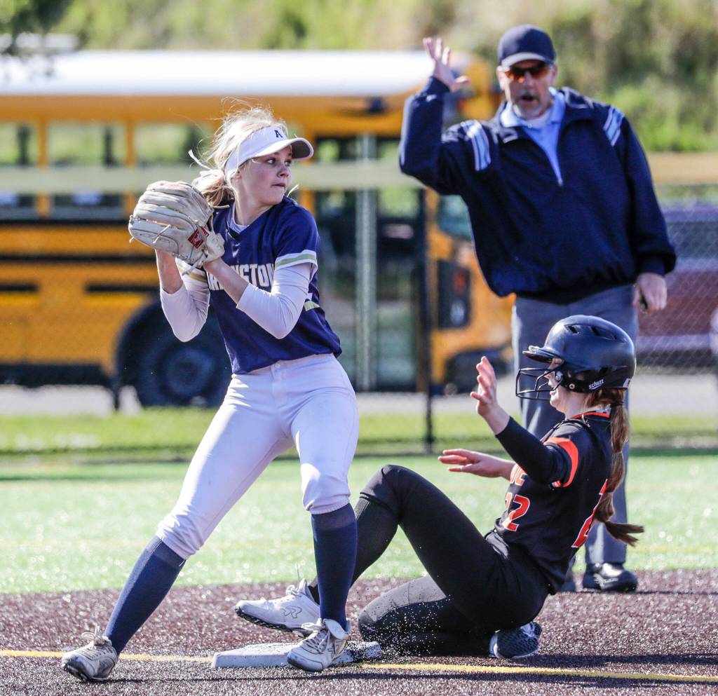 Arlingtons Avery Zodrow tags out Monroes Hadley Oylear at Phil Johnson Ball Field in Everett, Washington on May 19, 2022.(Kevin Clark / The Herald)