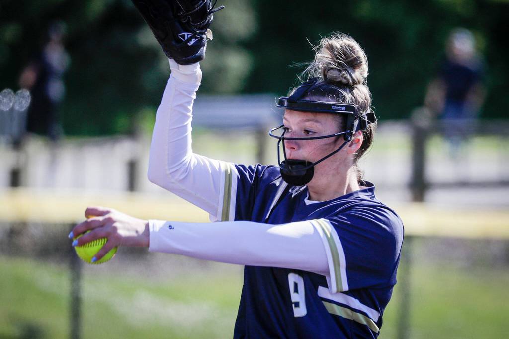 Arlingtons Lizzie Durfee throws a pitch against Monroe at Phil Johnson Ball Field in Everett, Washington on May 19, 2022.(Kevin Clark / The Herald)