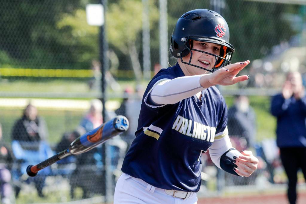 Arlingtons Ainsley Kahler achieves a walk against Monroe at Phil Johnson Ball Field in Everett, Washington on May 19, 2022.(Kevin Clark / The Herald)