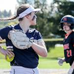 Arlingtons Tayler Stevens looks to Monroes Scarlett Nagy after a pop up catch at Phil Johnson Ball Field in Everett, Washington on May 19, 2022.(Kevin Clark / The Herald)