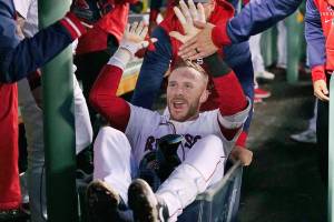 Boston Red Sox's Trevor Story is congratulated after his second two-run home run of the night, during the third inning of the team's baseball game against the Seattle Mariners at Fenway Park, Thursday, May 19, 2022, in Boston. (AP Photo/Charles Krupa)