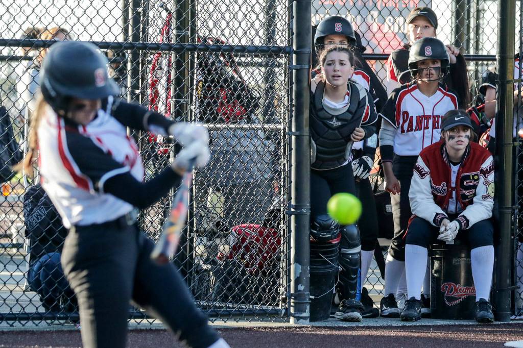 The Snohomish dugout watches Janell Williams at at against Cascade Thursday evening at Phil Johnson Ball Field in Everett, Washington on May 19, 2022. The Bruins defeated the Panthers 14-7 to claim the NW District 1 3A Championship title. (Kevin Clark / The Herald)