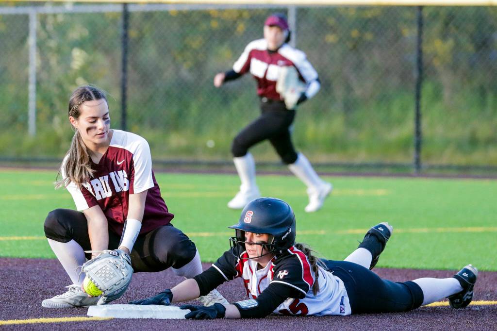 Cascades Ashlyee Bloch attempts to tag out Snohomishs Camryn Sage Thursday evening at Phil Johnson Ball Field in Everett, Washington on May 19, 2022. The Bruins defeated the Panthers 14-7 to claim the NW District 1 3A Championship title. (Kevin Clark / The Herald)