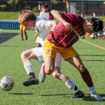 Edmonds-Woodways Benjamin Hanson, left and Lakesides Mateo Garces struggle for control of the ball during a Class 3A state tournament game Friday in Seattle. The Warriors lost 4-0. (Kevin Clark / The Herald) (Kevin Clark / The Herald)