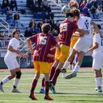 Edmonds-Woodways Deacon Fuentes heads the ball on a corner cook with Lakesides Andrew Streidl defending during a Class 3A state tournament game Friday in Seattle. The Warriors lost 4-0. (Kevin Clark / The Herald) (Kevin Clark / The Herald)