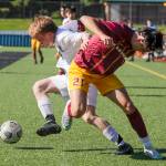 Edmonds-Woodways Benjamin Hanson, left and Lakesides Mateo Garces struggle for control of the ball Friday afternoon in Seattle, Washington on May 20, 2022. The Warriors lost 4-0. (Kevin Clark / The Herald)