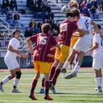 Edmonds-Woodways Deacon Fuentes heads the ball on a corner cook with Lakesides Andrew Streidl defending Friday afternoon in Seattle, Washington on May 20, 2022. The Warriors lost 4-0. (Kevin Clark / The Herald)