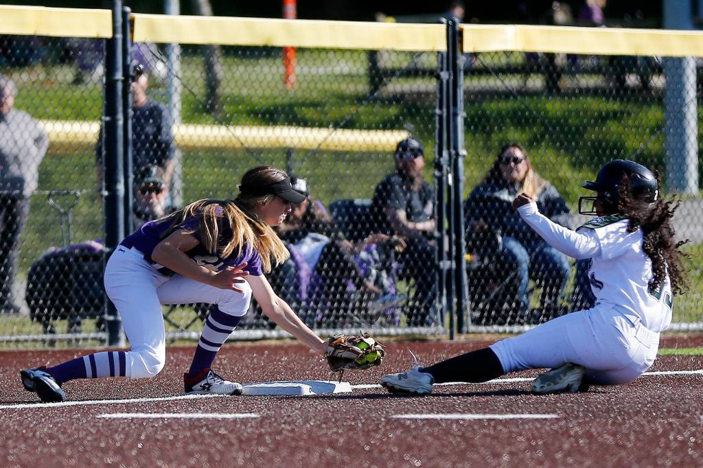 Lake Stevens Charli Pugmire tags out Jacksons Elena Eigner during a 4A bi-district matchup Friday at the Phil Johnson Ballfields in Everett. (Ryan Berry / The Herald)