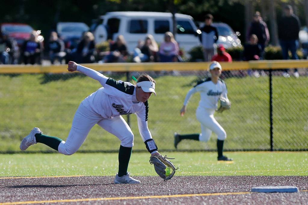 Jacksons Rachel Sysum makes a tough play at shortstop before throwing out a runner against Lake Stevens during a 4A bi-district matchup Friday at the Phil Johnson Ballfields in Everett.. (Ryan Berry / The Herald)