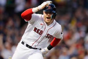 Boston Red Sox's Trevor Story looks to the dugout after hitting a grand slam against the Seattle Mariners during the third inning of a baseball game Friday, May 20, 2022, in Boston. (AP Photo/Michael Dwyer)
