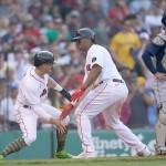 Boston Red Sox third baseman Rafael Devers, center, celebrates his fifth-inning home run with Enrique Hernandez during a game against the Seattle Mariners on Saturday in Boston. (AP Photo/Robert F. Bukaty)