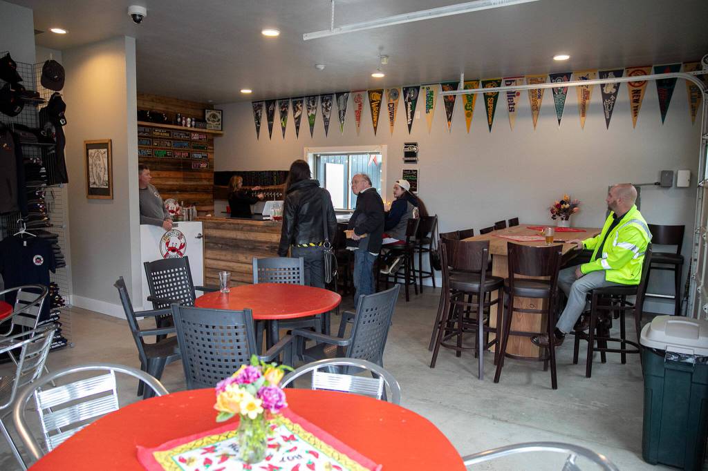 Customers begin to trickle in shortly after opening at Thirsty Crab Brewery. (Ryan Berry / The Herald)