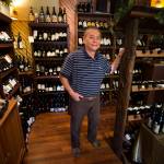 Bhu-Ping Thai owner Choosak Noi Chuenchowwai shows his wine collection in a room that connects to his restaurant on Evergreen Way in 2016. He recently closed the restaurant, and announced his retirement. (Ian Terry / Herald file)