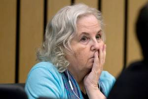 FILE - Romance writer Nancy Crampton Brophy, left, accused of killing her husband, Dan Brophy, in June 2018, watches proceedings in court in Portland, Ore., Monday, April 4, 2022. A jury in Portland, Oregon, has convicted the self-published romance novelist — who once wrote an essay titled "How to Kill Your Husband" — of fatally shooting her husband four years ago. (Dave Killen/The Oregonian via AP, Pool, File Photo)