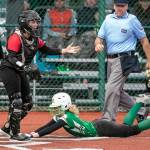 Snohomishs Alli Wilson looks for the throw with Roosevelts Sammie Wright sliding safely home in the 3A quarter-finals Friday evening in Lacey, Washington on May 27, 2022. The Panthers lost 14-13 in 8 innings. (Kevin Clark / The Herald)