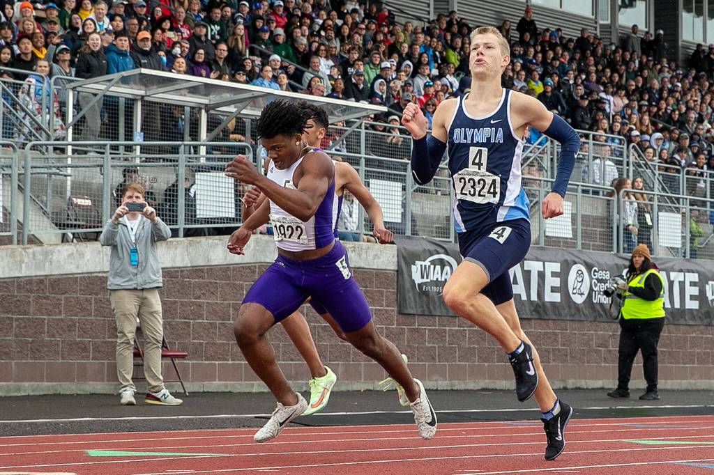 Lake Stevens Trayce Hanks, left, finished second to Olympias during Connor Johnson in the 400 meter cash State Track Championships Friday evening in Lacey, Washington on May 28, 2022. (Kevin Clark / The Herald)