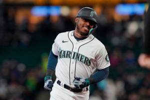 Seattle Mariners' Kyle Lewis rounds the bases after he hit a solo home run against the Houston Astros during the second inning of a baseball game, Saturday, May 28, 2022, in Seattle. (AP Photo/Ted S. Warren)
