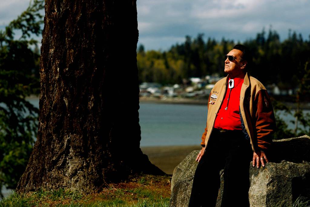 Stan Jones Sr. scans Tulalip Bay from the grounds outside the old tribal center and longhouse in April 2010. (Dan Bates / Herald file)