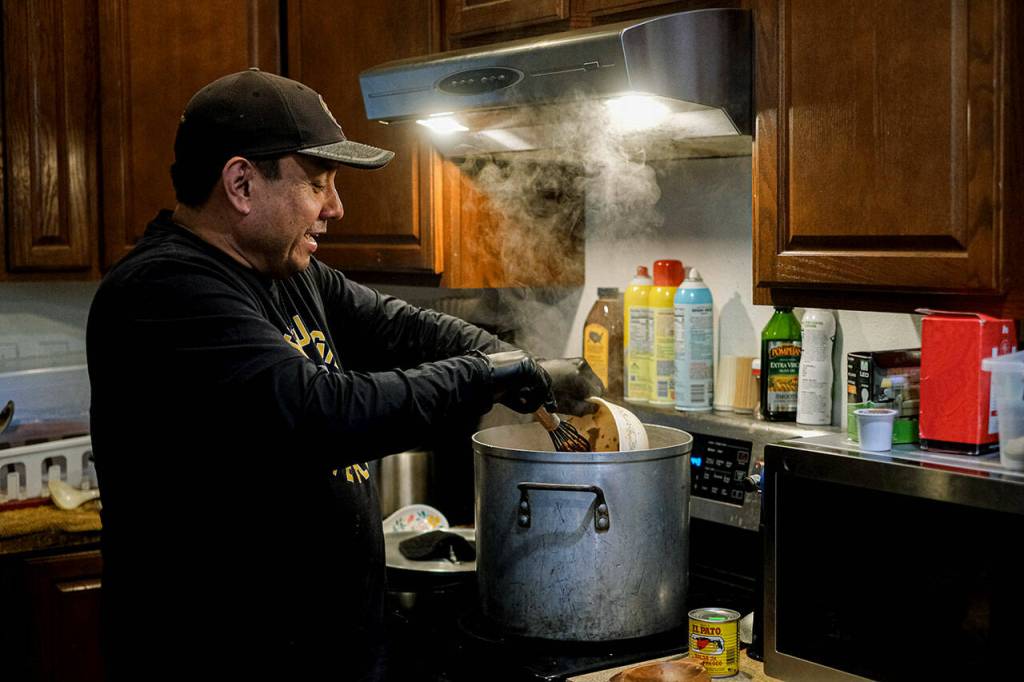 Terry Fast Horse, pictured here cooking chili for Indian tacos, is a Tulalip resident of Lummi and Lakota descent and a descendant of boarding school survivors. (Taylor Goebel / The Herald)