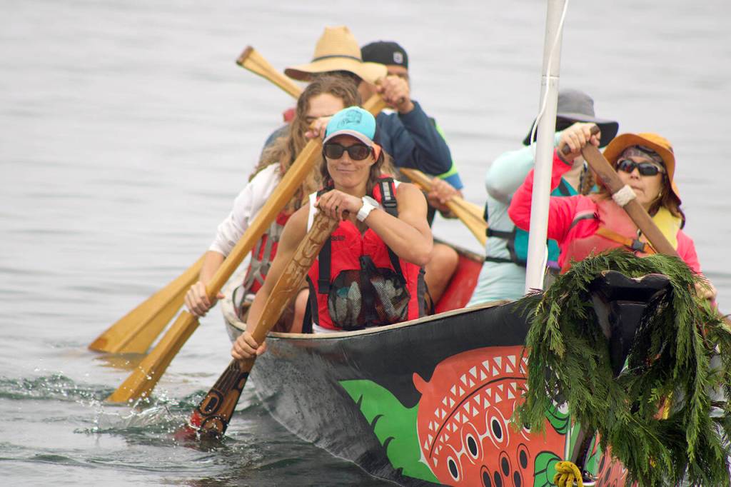 Paddlers begin their two-week journey to Lummi Island with the Blue Heron Canoe Family on Aug. 2, 2021. (Isabella Breda / The Herald)