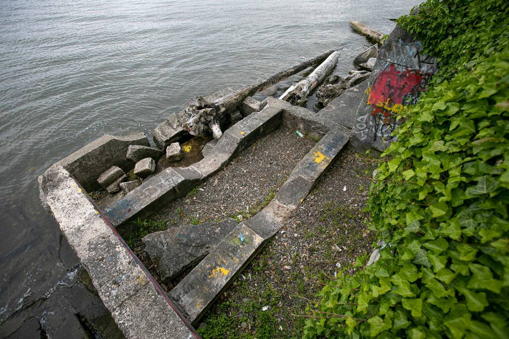The ruins of a federal jail on the beach of Tulalip Bay are seen on June 13, behind the Tulalip Montessori School in Tulalip. (Ryan Berry / The Herald)