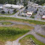 Traffic moves along Avenue D in Snohomish next to an open space that could be used for MFTE housing Snohomish is considering adding to the new Midtown District. (Olivia Vanni / The Herald)
