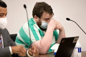 Alec Gajdos wipes his eyes after briefly speaking to the court during his sentencing hearing Tuesday, June 7, 2022, at the Snohomish County Courthouse in Everett, Washington. (Ryan Berry / The Herald)
