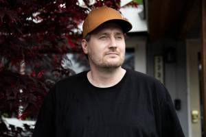John Merrell outside of his current sober living housing on Thursday, May 26, 2022 in Lynnwood, Washington. (Olivia Vanni / The Herald)