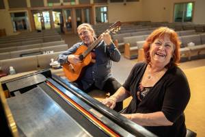 Daniel and Dee Sales laugh as they improvise a tune together before a student recital Wednesday, May 25, 2022, at Bothell United Methodist Church in Bothell, Washington. (Ryan Berry / The Herald)