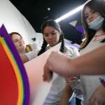 Girls work together on a creative project during Leadership Launchs Emotion Commotion event at Everett Community College. (Ryan Berry / The Herald)