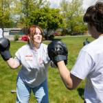Jeslyn Kelso, 16, spars with Alberto Garcia, 17, during a martial arts session at Leadership Launchs Emotion Commotion event. (Ryan Berry / The Herald)