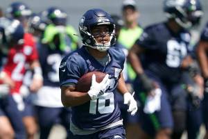 Seattle Seahawks wide receiver Tyler Lockett runs during NFL football practice, Tuesday, May 31, 2022, in Renton, Wash. (AP Photo/Ted S. Warren)