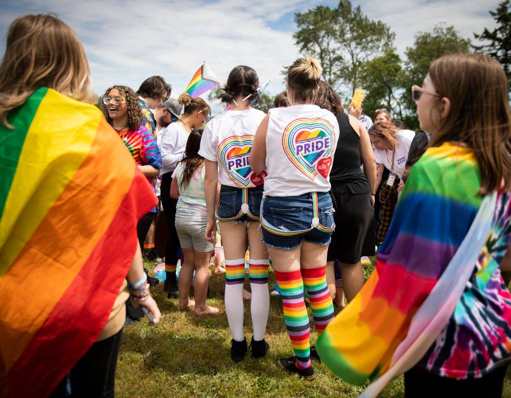 People gather for a color throw at Stanwood and Camanos first-ever Pride celebration Saturday at Freedom Park. (Olivia Vanni / The Herald)
