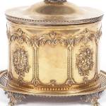 Every food you might find on a Victorian table had its own silver-plated dish. This English silver-plated jar was used for cookies or "bisquits."