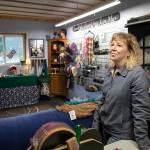 Rebecca Suryan stands inside the combined workshop and store Monday, March 28, 2022, at Alpacas from MaRS in Snohomish, Washington. (Ryan Berry / The Herald)