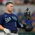 The Mariners Ty France tosses his gear after a lineout during the third inning of a game against the Rangers on Saturday in Arlington, Texas. (AP Photo/LM Otero)