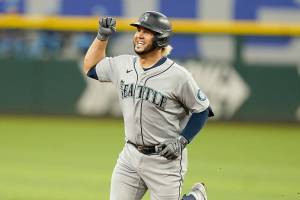 Seattle Mariners' Eugenio Suarez runs the bases after hitting a solo home run during the fourth inning of a baseball game against the Texas Rangers in Arlington, Texas, Sunday, June 5, 2022. (AP Photo/LM Otero)