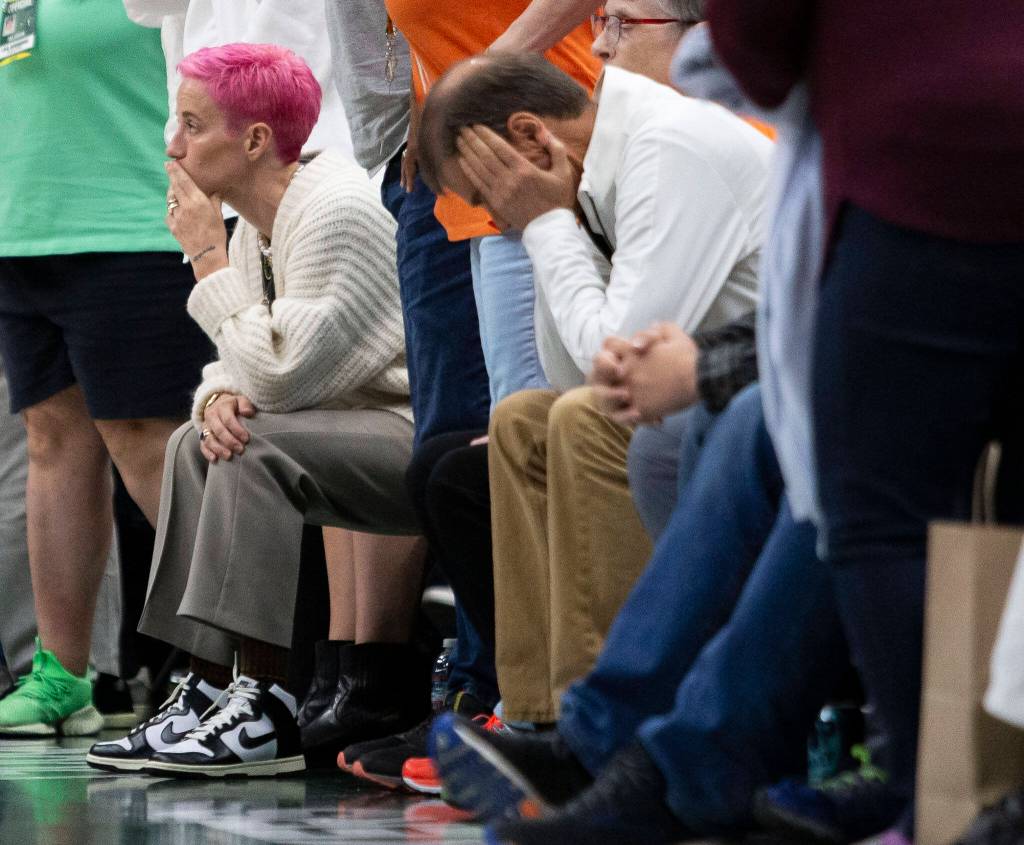 Megan Rapinoe and other Storm fans react to the loss against the Connecticut Sun during the final seconds of the game on Sunday, June 5, 2022 in Seattle, Washington. (Olivia Vanni / The Herald)