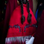 A young girl walks into the longhouse for the Salmon Ceremony on Saturday in Tulalip. (Olivia Vanni / The Herald)