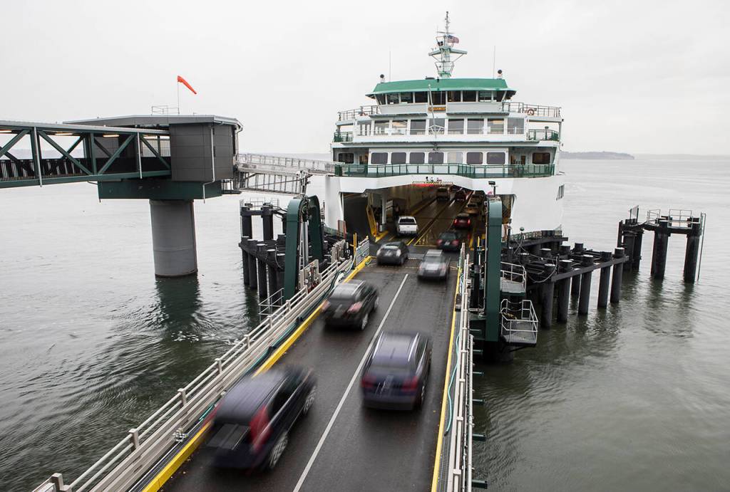 Vehicles board the ferry to Whidbey Island at the Mukilteo dock. (Olivia Vanni / The Herald)