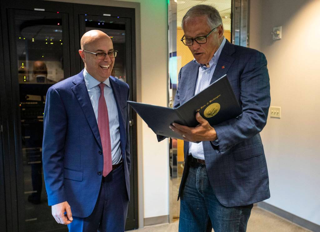 KRKO owner Andrew Skotdal receives an official proclamation from Governor Jay Inslee on Thursday in Everett. (Olivia Vanni / The Herald)